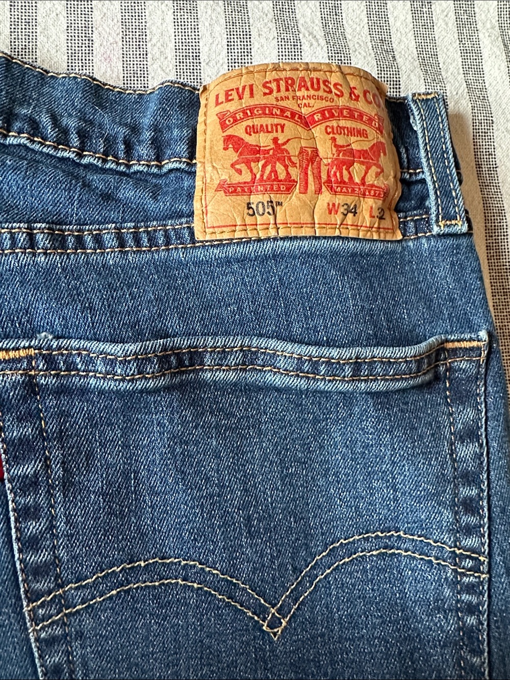 505 levi’s Strauss’s  Blue Denim Jeans with Tan Leather Patch